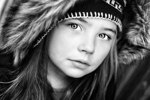 person grayscale photography of girl wearing hooded top black-and-white
