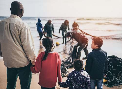 people group of people standing on seashore person