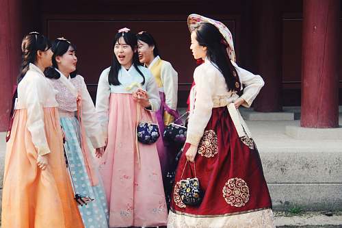 person group of woman wearing traditional dresses people
