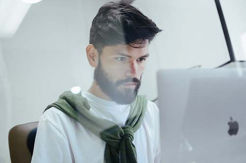 person man facing MacBook Pro people
