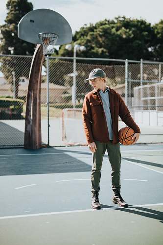people man holding basketball person