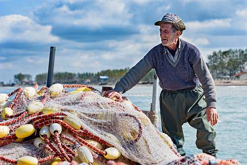 people man holding fishing net person