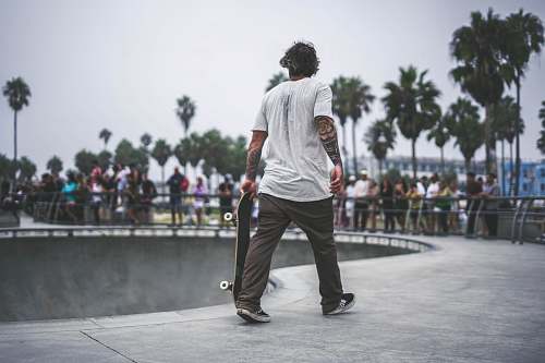 people man holding skateboard in skate park person