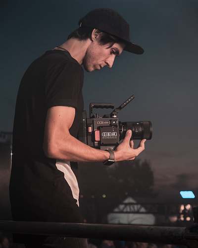 person man holding video camera people