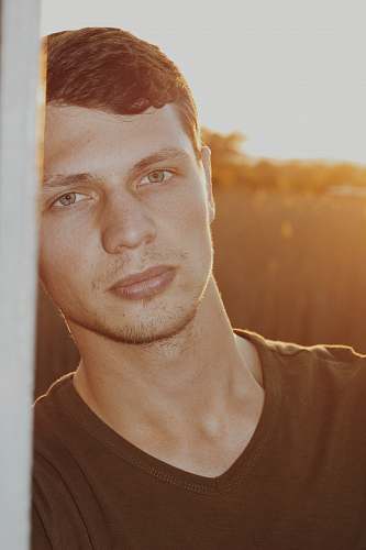 people man in black V-neck shirt person