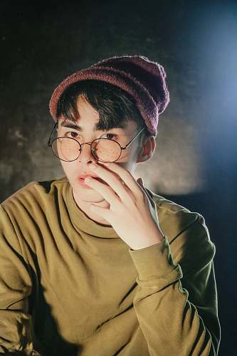 people man in brown crew-neck sweatshirt with brown beanie person