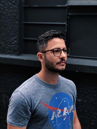 person man in gray Nasa crew-neck shirt people