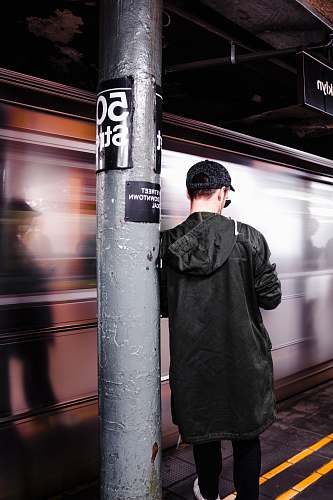 people man leaning on the post train