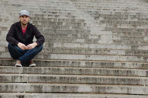 people man sitting on concrete stair person