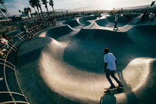 person man skating on ramps skateboard
