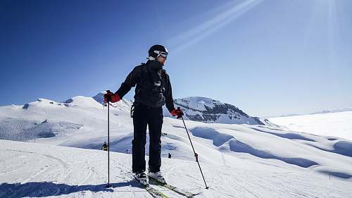 people man skiing under clear blue sky person