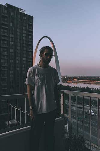 people man standing behind handrails person