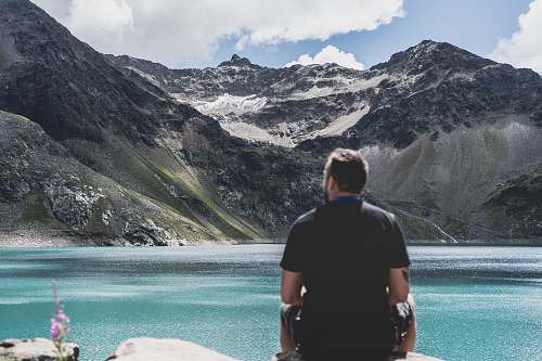 people man standing in front of mountain snow