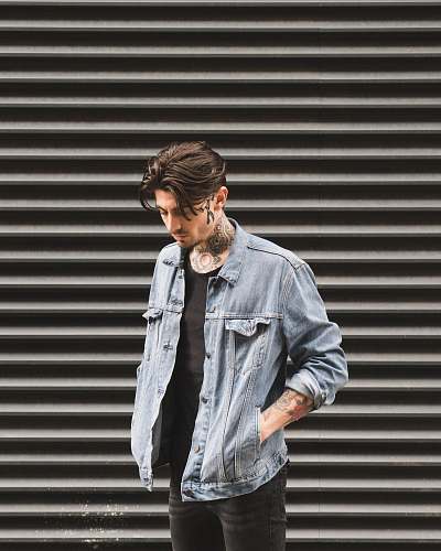 people man standing in front of roll-up door at daytime person