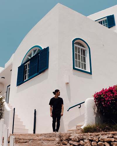 people man standing near house at daytime person
