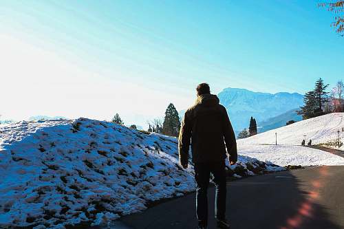 people man standing near snow pile person