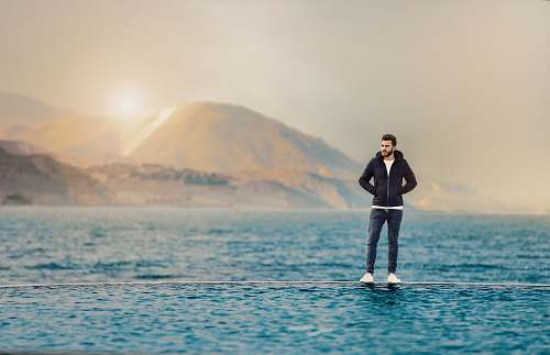 people man standing on body of water person