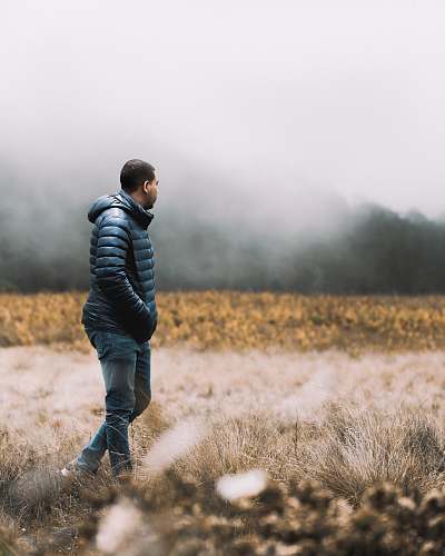 people man standing on field during daytime person