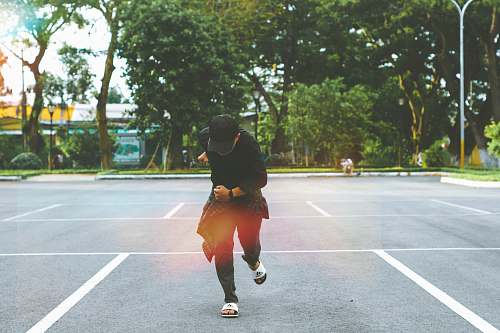 person man standing on parking lot people