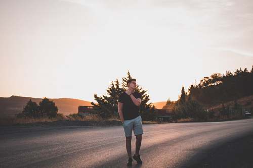 person man standing on road people