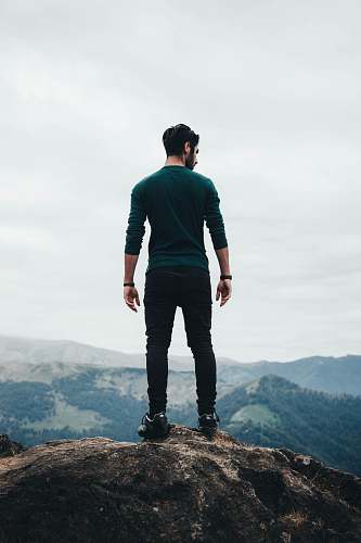 people man standing on rock formation person