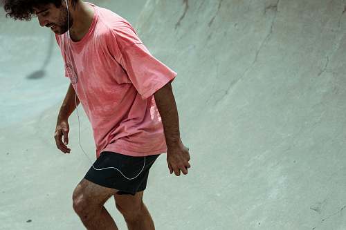 person man standing on skateboard track people