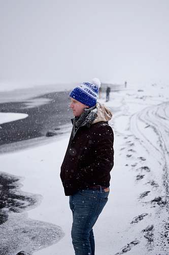 person man standing on snow during winter people