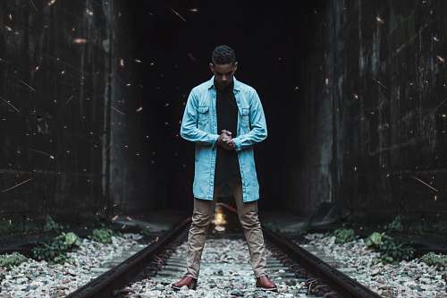 people man standing on train track person