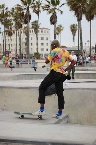 people man stepping on black skateboard on park person