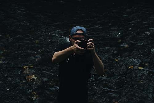 people man taking a photo using a DSLR camera person