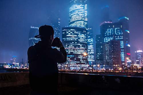 people man taking a picture of the building person
