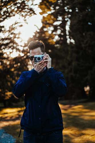 people man taking photo person
