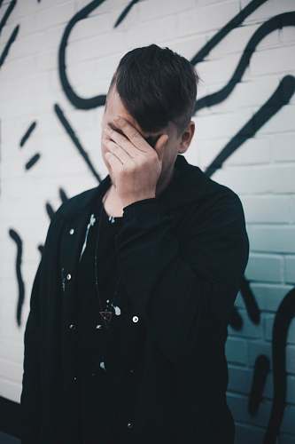 people man touching his forehead person