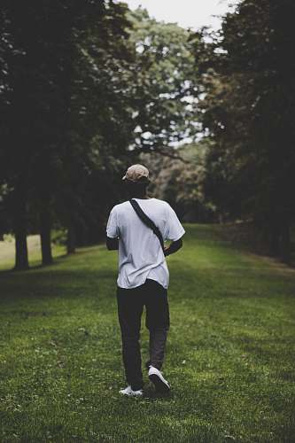 person man walking on lawn people
