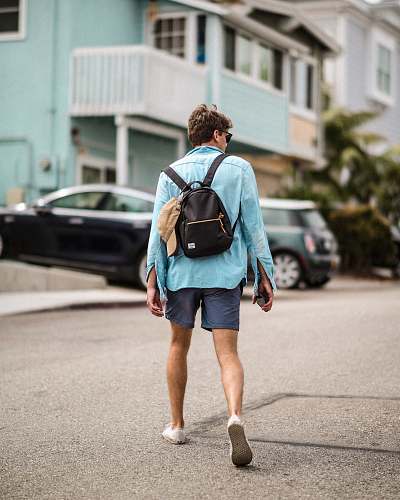 people man walking wearing blue dress shirt person