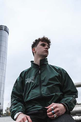 people man wearing black zip-up jacket person