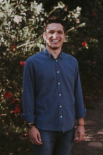 people man wearing blue and gray sport shirt person