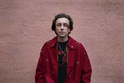 person man wearing red coat people