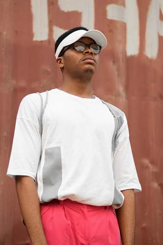 people man wearing sunvisor cap and white shirt person
