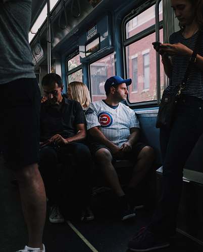people people sitting and standing inside the vehicle person