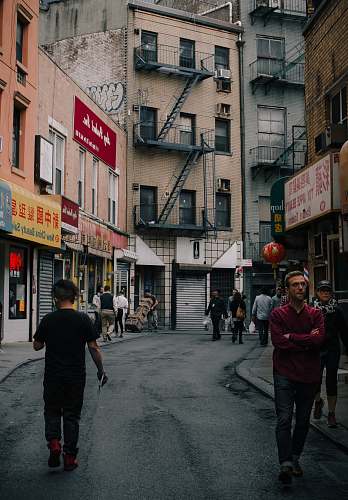 people people walking down the street at China person