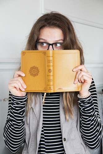 people person holding book person