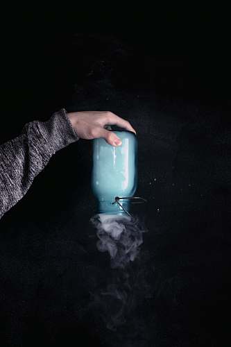 people person holding clear glass jar person