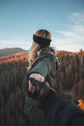 people person holding hand of woman person