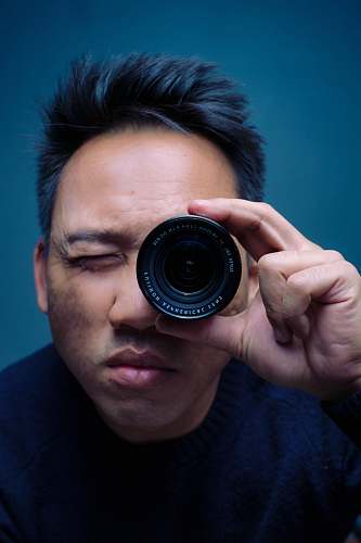people person holding zoom lens person
