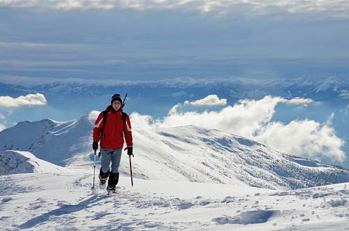 people person on snow mountain during daytime person