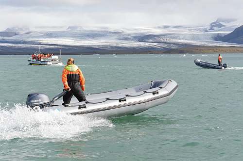people person riding on lifeboat boat