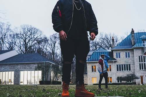 people person standing on grass field during daytime person