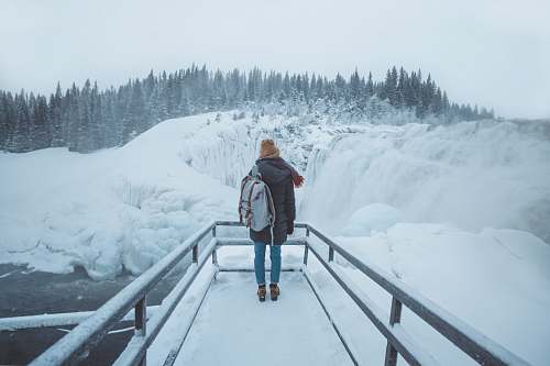 people person standing on pier during winter person