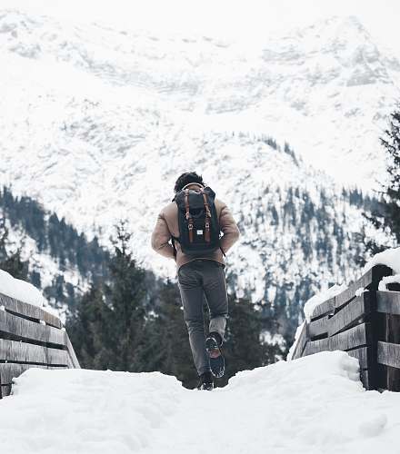 people person walking on snowy road person